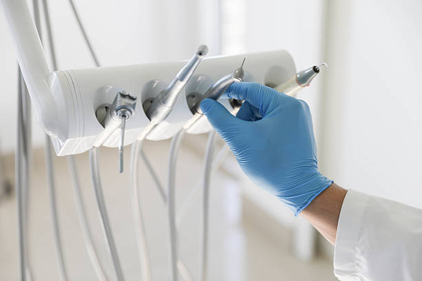 Professional Tooth Extraction technician working in Fredericksburg, VA